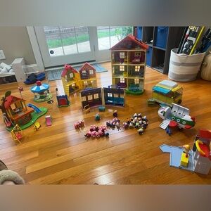 Lot of Peppa Pig toys.